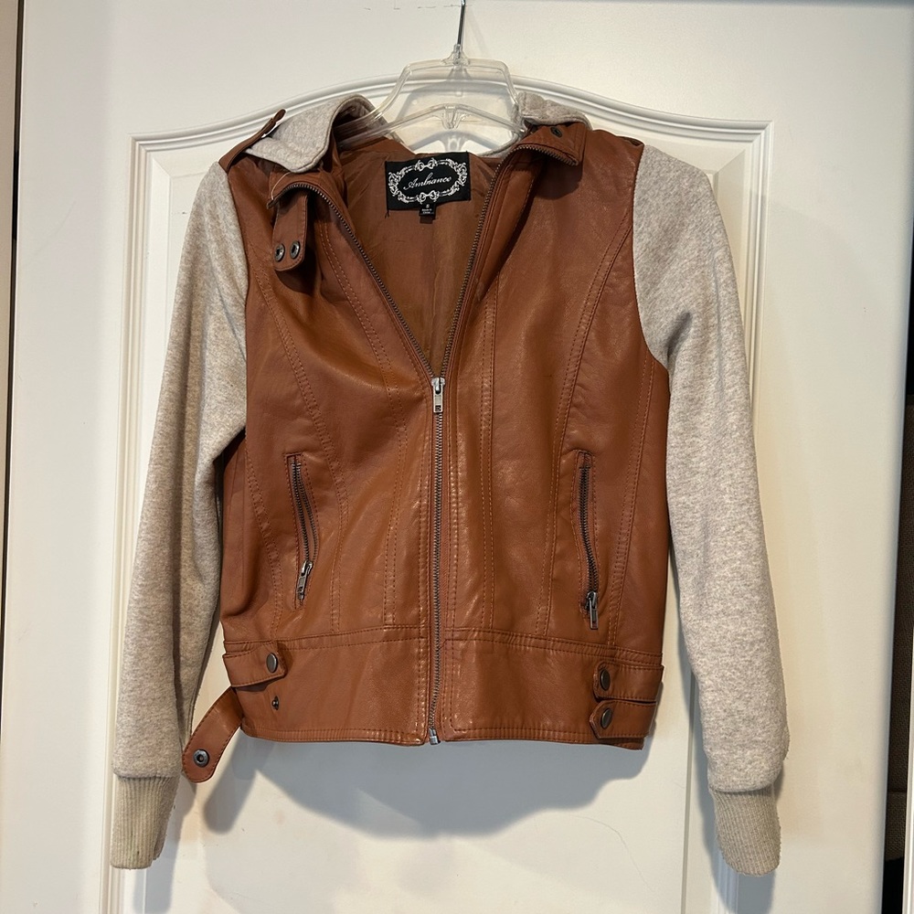 Faux brown leather jacket with sweatshirt sleeves and hood.